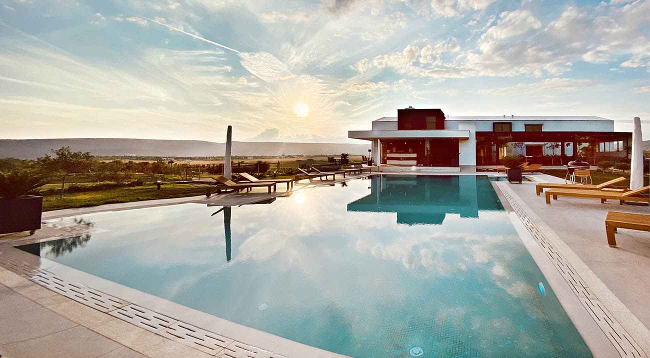 Poolside setting reviewed by guests on Booking.com