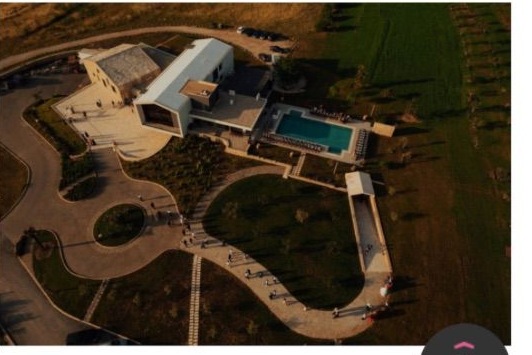 Aerial view of Emporia Wine & Dine Hotel, its pool, and the surrounding vineyards